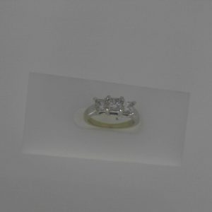 Estate Diamond Engagement Ring 
14 Karat White Estate Engagement Ring 
Finger Size 3.5 Gram Weight 3.2 
3 Center Diamonds Shape: Princess; Clarity: I1; Colour: J 0.7
