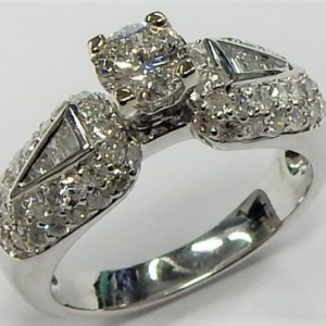 Estate Diamond Engagement Ring 
18 Karat White Estate Engagement Ring 
Finger Size 6 Gram Weight 6 
1 Center Diamond 0.47ct Shape: Round; Clarity: SI1; Colour: I Various Shapes Diamond 0.75 ctw 1.22