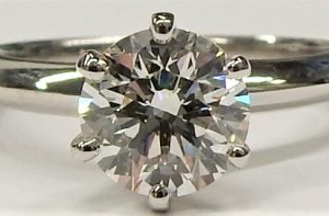 Estate Diamond Engagement Ring 
Platinum White Estate Engagement Ring 
Finger Size 4.5 Gram Weight 4.5 
1 Center Diamond 1.11ct Shape: Round; Clarity: VS2; Colour: H 1.11