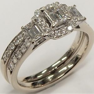 Estate Diamond Engagement Ring 
14 Karat White Estate Engagement Ring 
Finger Size 6 Gram Weight 4.8 
1 Center Diamond 0.19ct Shape: Emerald; Clarity: SI1; Colour: I With 2 Emerald Diamonds 0.14 ctw and 26 Round Diamonds 0.16 ctw 0.49