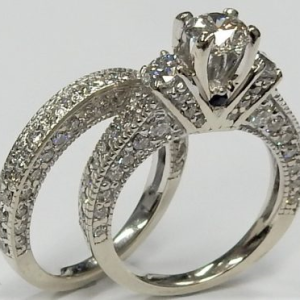 Estate Diamond Engagement Ring 
14 Karat White Estate Engagement Ring 
 Gram Weight 8.9 
2 Center Sapphires Shape: Round; Colour: Blue With 117 Round Diamonds 2.00 ctw and 1 Round Diamond 0.70 ctw 2.7