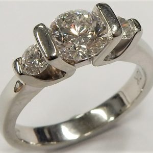 Estate Diamond Engagement Ring 
19 Karat White Estate Engagement Ring 
Finger Size 6.5 Gram Weight 6.3 
1 Center Diamond 0.90ct Shape: Round; Clarity: SI2; Colour: G With 2 Round Diamonds 0.28 ctw 1.18