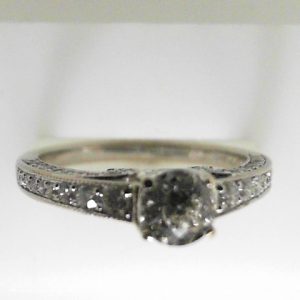 Estate Diamond Engagement Ring 
14 Karat White Estate Engagement Ring 
 Gram Weight 3 
58 Center Diamonds Shape: Round; Clarity: I1; Colour: I With 1 Round Diamond 0.46 ctw 0.96