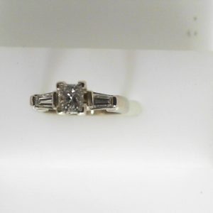 Estate Diamond Engagement Ring 
14 Karat White Estate Engagement Ring 
Finger Size 4.75 Gram Weight 3.83 
1 Center Diamond 0.50ct Shape: Princess; Clarity: VS; Colour: H/I With 2 Baguette Diamonds 0.22 ctw 0.72