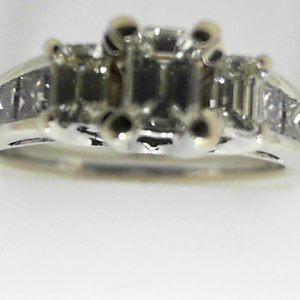 Estate Diamond Engagement Ring 
14 Karat White Estate Engagement Ring 
Finger Size 7 Gram Weight 4.1 
1 Center Diamond 0.37ct Shape: Emerald; Clarity: VS2; Colour: G/H With 2 Emerald Diamonds 0.36 ctw and 6 Princess Diamonds 0.38 ctw 1.11