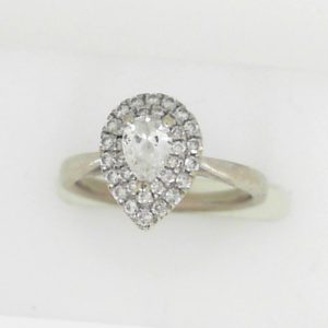 Estate Diamond Engagement Ring 
10 Karat White Estate Engagement Ring 
Finger Size 4.5 Gram Weight 2.57 
1 Center Diamond 0.30ct Shape: Pear; Clarity: SI1; Colour: G/H With 34 Round Diamonds 0.20 ctw 0.5