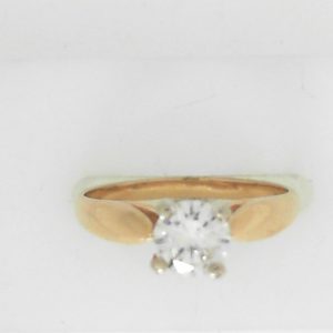 Estate Diamond Engagement Ring 
14 Karat Yellow Estate Engagement Ring 
Finger Size 7 Gram Weight 2.8 
1 Center Diamond 0.68ct Shape: Round; Clarity: I1; Colour: I 0.68