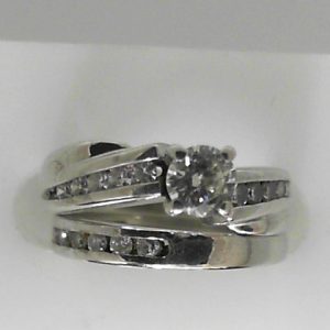 Estate Diamond Engagement Ring 
14 Karat White Estate Engagement Ring 
Finger Size 4.75 Gram Weight 5.39 
1 Center Diamond 0.33ct Shape: Fantasy Cut; Clarity: SI1; Colour: J With 19 Round Diamonds 0.35 ctw 0.68