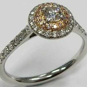 Tiffany & Co. Estate Diamond Engagement Ring 
18K/Platinum Rose/White Estate Engagement Ring 
Finger Size 5 Gram Weight 3.5 
40 Center Diamonds Shape: Round