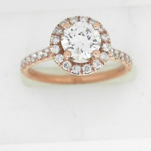 Estate Diamond Engagement Ring 
14 Karat Rosé Estate Engagement Ring Width 2mm 
Finger Size 6 Gram Weight 3.2 
1 Center Diamond 0.72ct Shape: Round; Clarity: SI2; Colour: H With 32 Round Diamonds 0.38 ctw 1.1