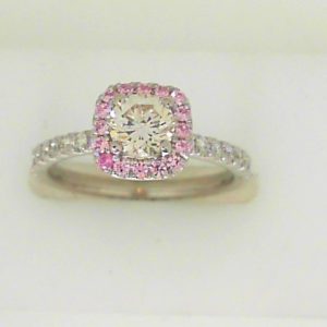 Estate Diamond Engagement Ring 
14 Karat White Estate Engagement Ring 
Finger Size 6 Gram Weight 2.54 
1 Center Diamond 0.55ct Shape: Round; Clarity: VS; Colour: K/L With 22 Round Diamonds 0.28 ctw and 17 Round Sapphires 0.83