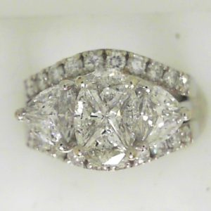 Estate Diamond Engagement Ring Set
14 Karat White Estate Engagement Ring 
Finger Size 5.75 Gram Weight 10 
8 Center Diamonds Shape: Various Shapes; Clarity: SI1; Colour: H With 2 Various Shapes Diamonds 0.34 ctw and 20 Round Diamonds 0.67 ctw 2.13 on t