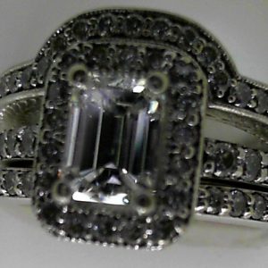 Estate Diamond Engagement Ring Set of 3
14 Karat White Estate Engagement Ring 
Finger Size 4.5 Sizing available for a fee
1 Center Diamond 1.09ct Shape: Emerald; Clarity: SI; Colour: F With 79 Round Diamonds 0.75 ctw 1.84