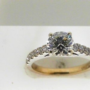 Estate Diamond Engagement Ring 
14 Karat White Estate Engagement Ring 
Finger Size 7 Gram Weight 3.8 
1 Center Diamond 1.08ct Shape: Round; Clarity: SI1; Colour: H/I With 12 Round Diamonds 0.36 ctw 1.44