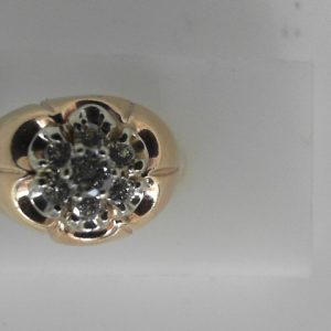 Estate Diamond Ring - Men's 
10 Karat Yellow Estate Diamond Ring 
Finger Size 7 Gram Weight 6.6 
7 Center Diamonds Shape: Round; Clarity: VS1; Colour: I/J 0.75