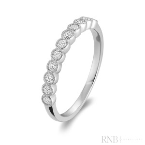 Diamond Wedding/Anniversary Ring 
14 Karat White Wedding/Anniversary Ring 
Finger Size 6.5 Gram Weight 1.57 
11 Center Diamonds Shape: Round; Clarity: I1; Colour: G/H 0.25