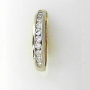 Estate Diamond Anniversary Ring 
14 Karat Yellow Estate Anniversary Ring Width 2.6mm 
Finger Size 5 Gram Weight 2.2 
10 Center Diamonds Shape: Round; Clarity: SI1; Colour: G/H 0.3