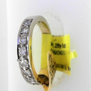 Estate Diamond Anniversary Ring 
14 Karat White Estate Anniversary Ring Width 3.04mm 
Finger Size 5.5 Gram Weight 3.5 
9 Center Diamonds Shape: Round; Clarity: I1; Colour: I 0.25