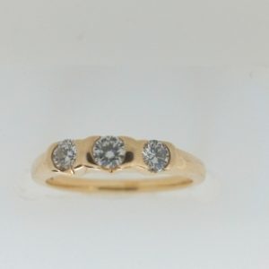 Estate Diamond Anniversary Ring 
18 Karat Yellow Estate Anniversary Ring 
Finger Size 4.5 Gram Weight 2.8 
3 Center Diamonds Shape: Round; Clarity: VS1; Colour: H 0.25