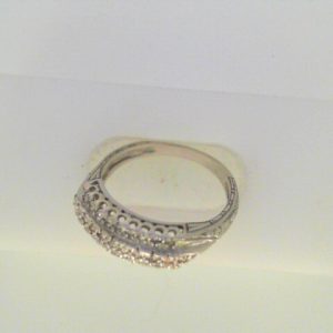 Estate Diamond Anniversary Ring 
14 Karat White Estate Anniversary Ring Width 2.1mm 
Finger Size 7 Gram Weight 3.3 
29 Center Diamonds Shape: Round; Clarity: I1; Colour: H/I 0.15