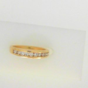 Estate Diamond Anniversary Ring 
14 Karat Yellow Estate Anniversary Ring 
Finger Size 5 Gram Weight 2.5 
 Center Diamond Shape: Round; Clarity: I1; Colour: K 0.25