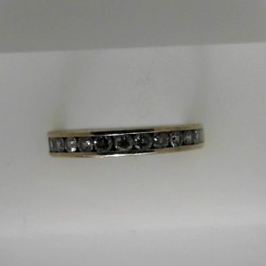 Estate Diamond Anniversary Ring 
14 Karat White Estate Anniversary Ring 
Finger Size 6 Gram Weight 2.5 
12 Center Diamonds Shape: Round; Clarity: I1; Colour: I/J 0.55