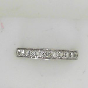 Estate Diamond Anniversary Ring 
18 Karat White Estate Anniversary Ring 
Finger Size 7 Gram Weight 3.2 
13 Center Diamonds Shape: Round; Clarity: VS; Colour: H 0.4