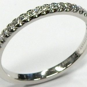 Estate Tiffany Diamond Anniversary Ring 
Platinum White Estate Anniversary Ring Width 2mm 
Finger Size 6 Gram Weight 2.7 
20 Center Diamonds Shape: Round