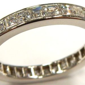 Estate Diamond Anniversary Ring 
Platinum White Estate Anniversary Ring Width 2.75mm 
Finger Size 5.25 Gram Weight 3.1 
32 Center Diamonds Shape: Baguette; Clarity: VS; Colour: G/H 1.25ct tw.
5 stones have chipped corners.