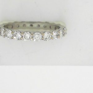 Estate Diamond Anniversary Ring 
18 Karat White Estate Anniversary Ring 
Finger Size 6.5 Gram Weight 2.2 
23 Center Diamonds Shape: Round; Clarity: VS; Colour: I 1.38