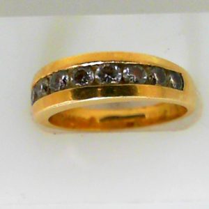 Estate Diamond Anniversary Ring 
14 Karat Yellow Estate Anniversary Ring 
Finger Size 6.5 Gram Weight 4.5 
10 Center Diamonds Shape: Round; Clarity: I1; Colour: J 1