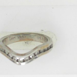 Estate Diamond Anniversary Ring 
14 Karat White Estate Anniversary Ring 
Finger Size 5.5 Gram Weight 3.5 
15 Center Diamonds Shape: Round; Clarity: SI1; Colour: I 0.28