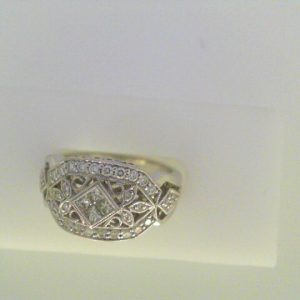 Diamond Dinner Ring - Women's 
18 Karat White Dinner Ring 
Finger Size 7 
 Center Diamond Shape: Various Shapes Clarity: VS1 Colour: F/G 0.5