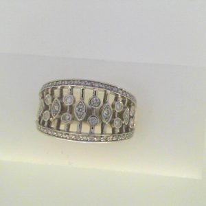 Diamond Dinner Ring - Women's 
10 Karat White Dinner Ring Width 5.2mm 
Finger Size 6.5 Gram Weight 5.4 
 Center Diamond Shape: Round 0.5