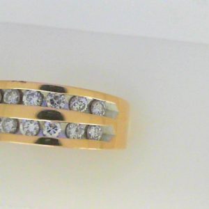 Diamond Dinner Ring - Women's 
14 Karat Yellow Dinner Ring Width 4.8mm 
Finger Size 6.75 Gram Weight 6.1 
14 Center Diamonds Shape: Round 0.54