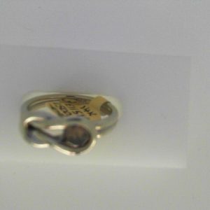 Estate Diamond Dinner Ring - Women's 
14 Karat White Estate Dinner Ring Width 4.85mm 
Finger Size 7 Gram Weight 4.32 
1 Center Diamond; 0.50ct Shape: Round; Clarity: I2 0.5