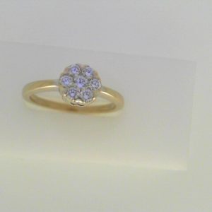 Estate Diamond Dinner Ring - Women's 
14 Karat White Estate Dinner Ring Width 1.9mm 
Finger Size 7 Gram Weight 3.1 
7 Center Diamonds Shape: Round; Clarity: SI1; Colour: H/I 0.35