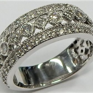 Estate Diamond Dinner Ring - Women's 
14 Karat White Estate Dinner Ring 
Finger Size 5.75 Gram Weight 5.04 
65 Center Diamonds Shape: Round; Clarity: VS1; Colour: G/H 0.85