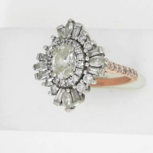 Estate Diamond Dinner Ring - Women's 
14 Karat Rosé Estate Dinner Ring Width 1.97mm 
Finger Size 5.25 Gram Weight 6.06 
1 Center Diamond; 0.70ct Shape: Oval; Clarity: SI1; Colour: I 487192382 Various Shapes Diamond 1.30 ctw 2