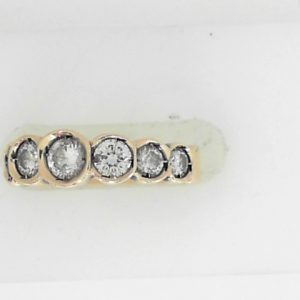 Estate Diamond Dinner Ring - Women's 
14 Karat Yellow Estate Dinner Ring 
Finger Size 4.5 Gram Weight 3.67 
7 Center Diamonds Shape: Round; Clarity: I1; Colour: J 0.78