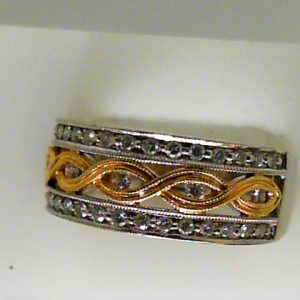 Estate Diamond Dinner Ring - Women's
14 Karat Yellow/White Estate Dinner Ring
Finger Size 6.5 Gram Weight 5.7
35 Center Diamonds Shape: Round; Clarity: VS2; Colour: I 0.36