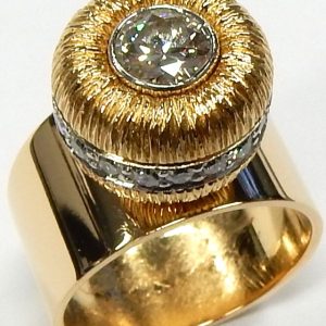 Cavelti Estate Diamond Ring
18 Karat Yellow Estate Dinner Ring 
Finger Size 5.5 Gram Weight 12 
1 Center Diamond; 0.65ct Shape: Round Transition Cut; Clarity: VS1; Colour: H 0.65
Accent Diamonds .47ct round