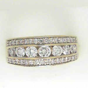 Estate Diamond Dinner Ring - Women's 
14 Karat White Estate Dinner Ring 
Finger Size 7 Gram Weight 6.29 
7 Center Diamonds Shape: Round; Clarity: I1; Colour: I With 32 Round Diamonds 0.30 ctw 1