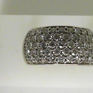 Estate Diamond Dinner Ring - Women's 
14 Karat White Estate Dinner Ring Width 11mm 
Finger Size 8.5 Gram Weight 9.2 
47 Center Diamonds Shape: Round; Clarity: I1; Colour: I 2