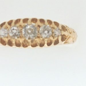 Estate Diamond Dinner Ring - Women's 1800's
18 Karat Yellow Estate Dinner Ring 
Finger Size 7 Gram Weight 2.52 
5 Center Diamonds Shape: Old Mine Cut; Clarity: VS; Colour: H 0.25