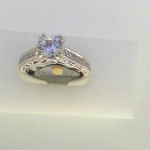 Diamond Semi-Mount Ring 
14 Karat White Ring 
Finger Size 6.25 
1 Center Cubic Zirconium 1.00ct Shape: Round Round Diamond 0.28 ctw 1.28