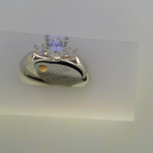 Diamond Semi-Mount Ring 
14 Karat White Ring 
Finger Size 6.25 
1 Center Cubic Zirconium 1.00ct Shape: Round Round Diamond 0.28 ctw 1.28