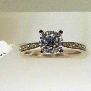 Diamond Semi-Mount Ring 
14 Karat White Ring 
Finger Size 6.5 
 Center Diamond Shape: Round; Clarity: SI1; Colour: G/H With 1 Round Cubic Zirconium 0.75 ctw 0.91