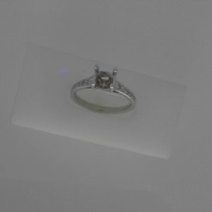 Diamond Semi-Mount Ring 
14 Karat White Ring 
Finger Size 6.75 Gram Weight 3.13 
 Center Diamond Shape: Round 0.22