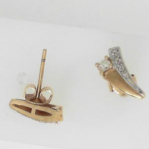 Estate Diamond Earrings 
14 Karat Yellow Estate Diamond Earrings 
Gram Weight 2.21 
2 Center Diamonds Shape: Princess; Clarity: VS; Colour: I/J With 8 Round Diamonds 0.05 ctw 0.2